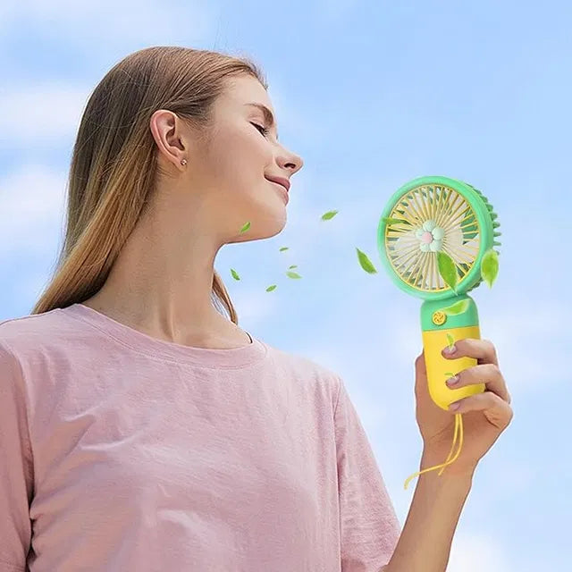 Mini handheld fan by 4485 with a floral design, portable and battery-operated, ideal for outdoor travel and commuting.