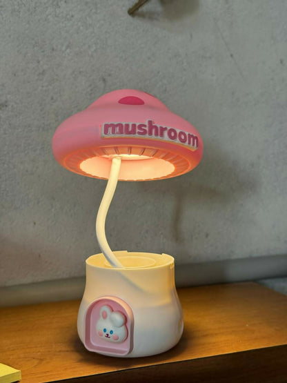 Wukusy Mushroom LED desk lamp with integrated pencil sharpener and USB charging port, in a colorful, mushroom-shaped design.