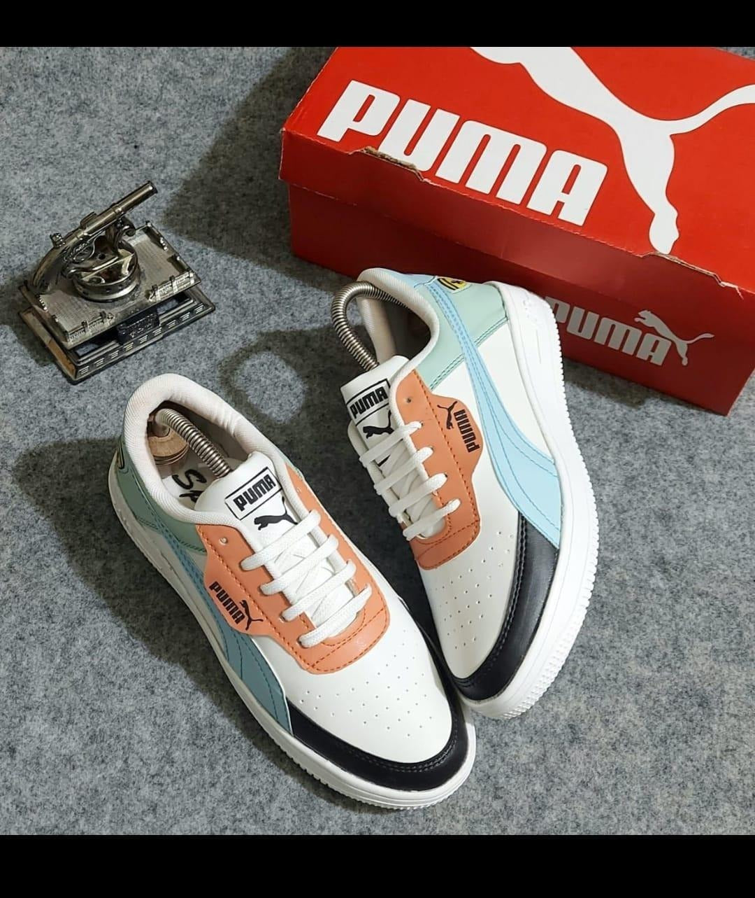 White and sky blue men's sneakers by 4597, size 6, featuring a stylish design with comfortable athletic soles.