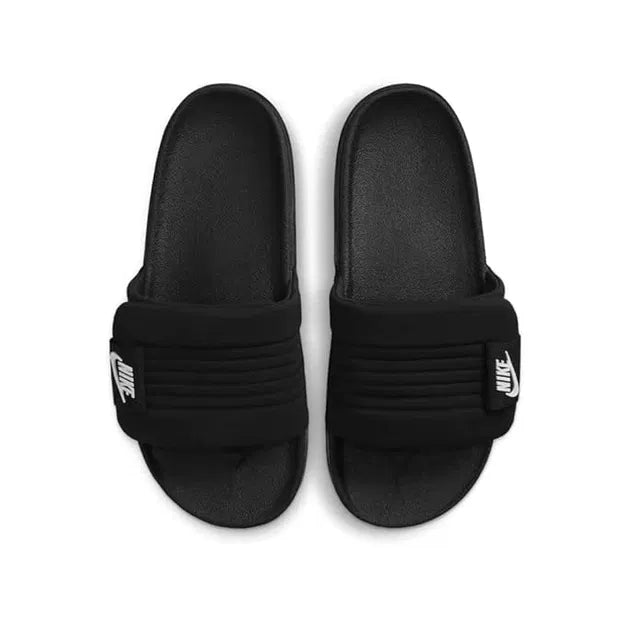Black Nike slides, size 6, casual slippers with Nike branding, featuring a simple slip-on design and cushioned footbed.