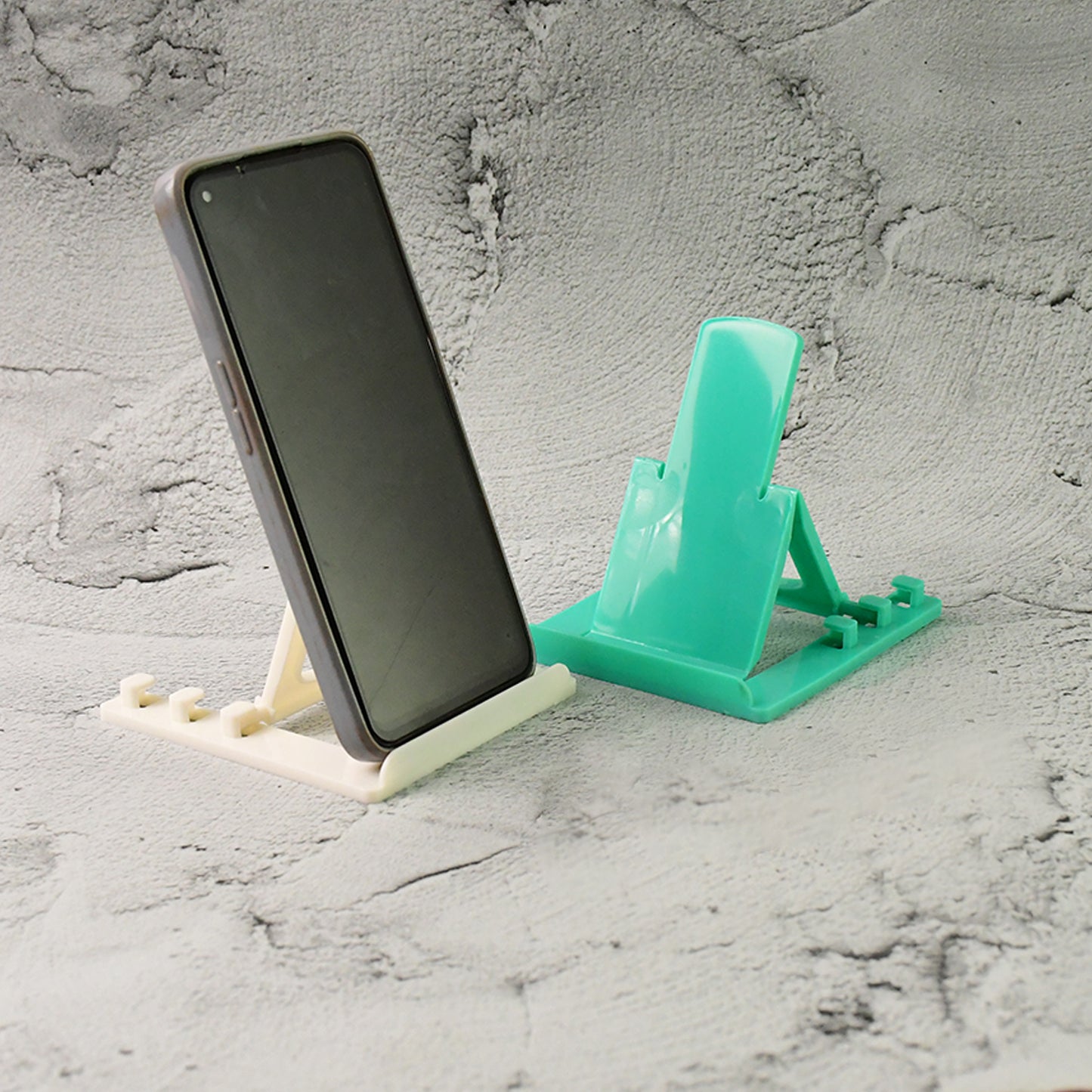 Two Wukusy adjustable foldable plastic mobile phone stands for hands-free viewing and support, shown in an open and folded position.