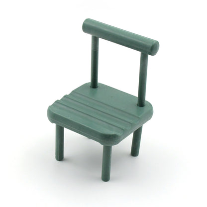 Wukusy portable mini chair mobile phone holder on a desk, compatible with all smartphones, designed for convenient desktop use.