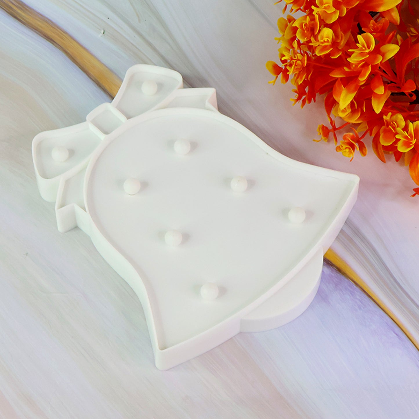 Wukusy bell-shaped LED decorative night light for home decor, showcasing a warm glowing night light with a stylish bell design.