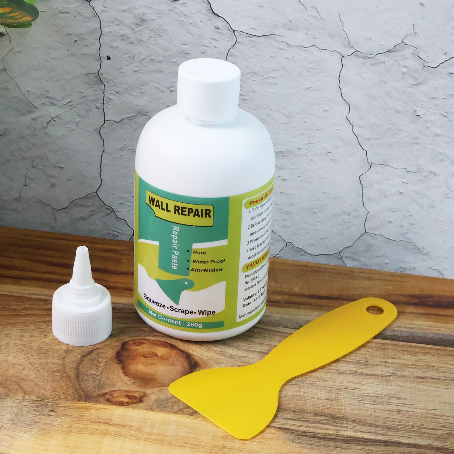 Wukusy wall crack repair cream with scraper set showing tubes of repair cream and a plastic scraper for fixing wall cracks