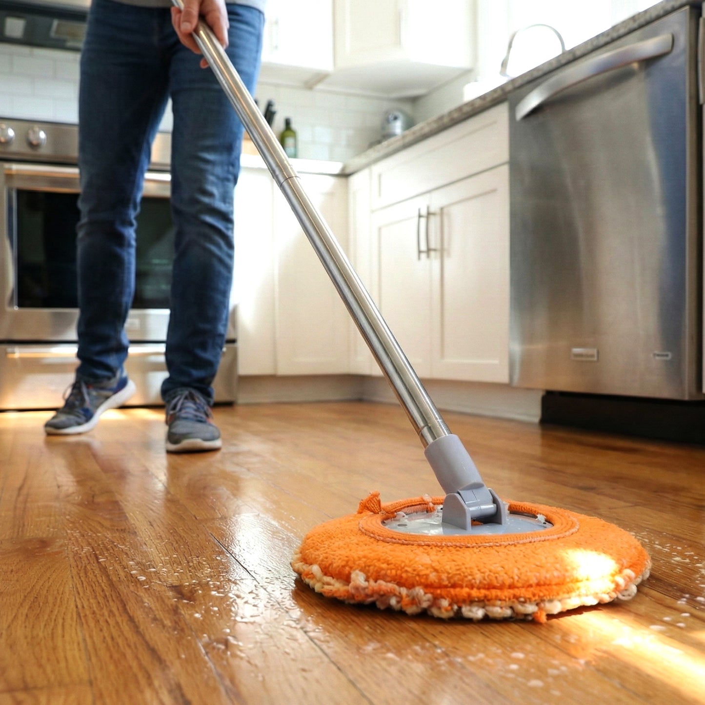 Wukusy multipurpose spin mop set with adjustable handle and microfiber cleaning head, ideal for various floor surfaces.