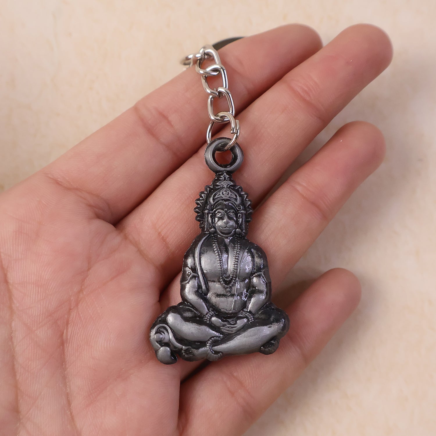 Premium Wukusy Hanuman Ji metal keychain in sitting pose, spiritual accessories featuring detailed craftsmanship.