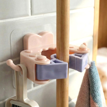 Wukusy wall mounted broom and mop holder clips set with four durable clips for organizing cleaning tools.