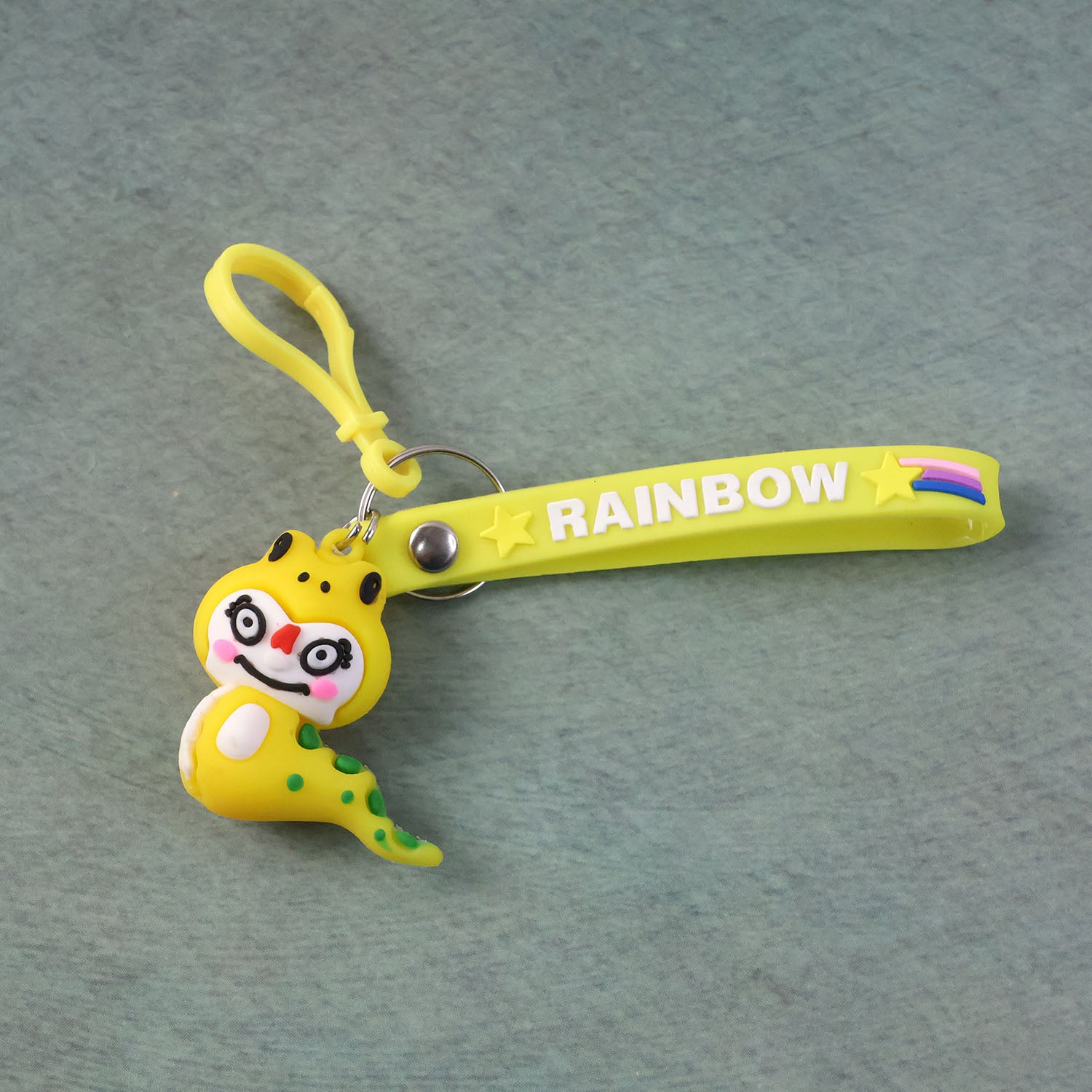 Cute cartoon dinosaur keychain from Wukusy, featuring a colorful, playful dinosaur design on a keyring.