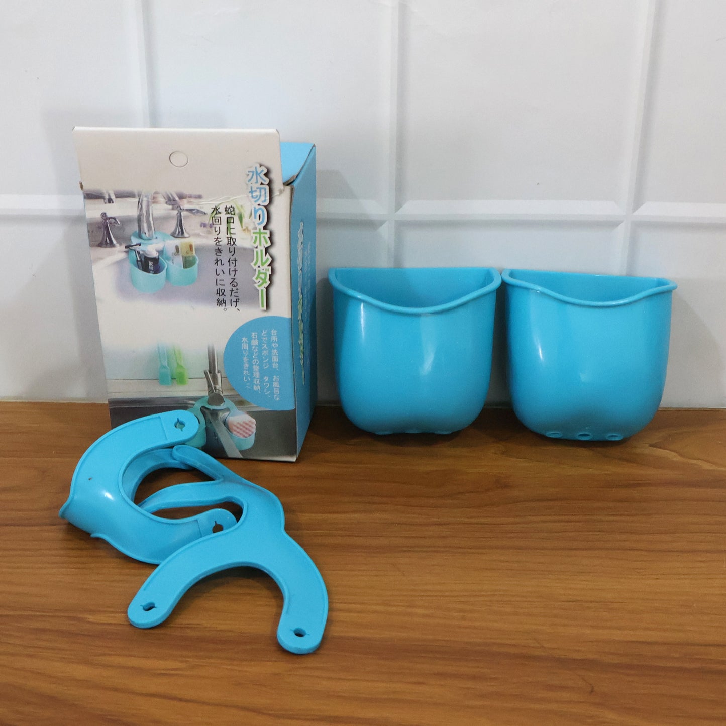 Wukusy double layer hanging storage basket for kitchen sink, made of durable mesh and plastic, ideal for organizing cleaning supplies.