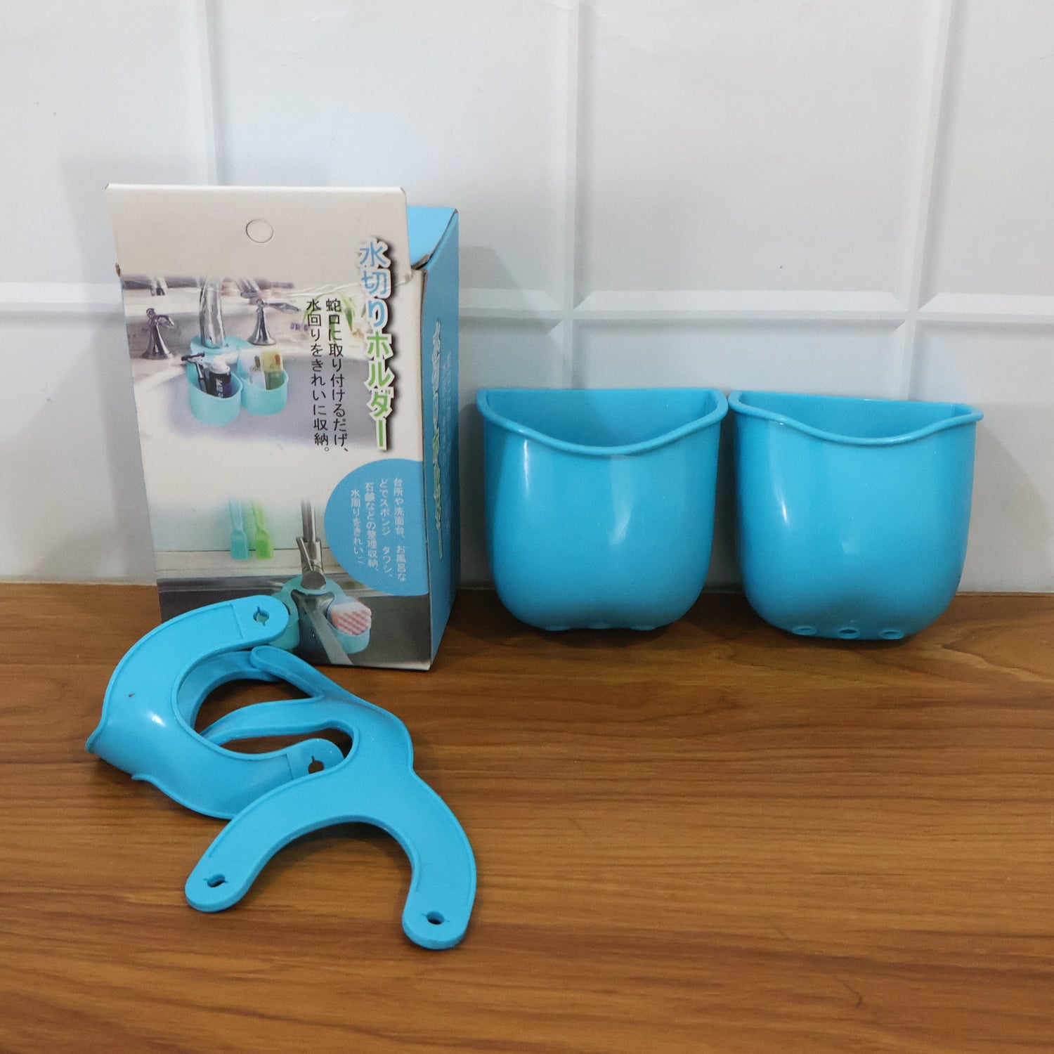 Wukusy double layer hanging storage basket for kitchen sink, made of durable mesh and plastic, ideal for organizing cleaning supplies.