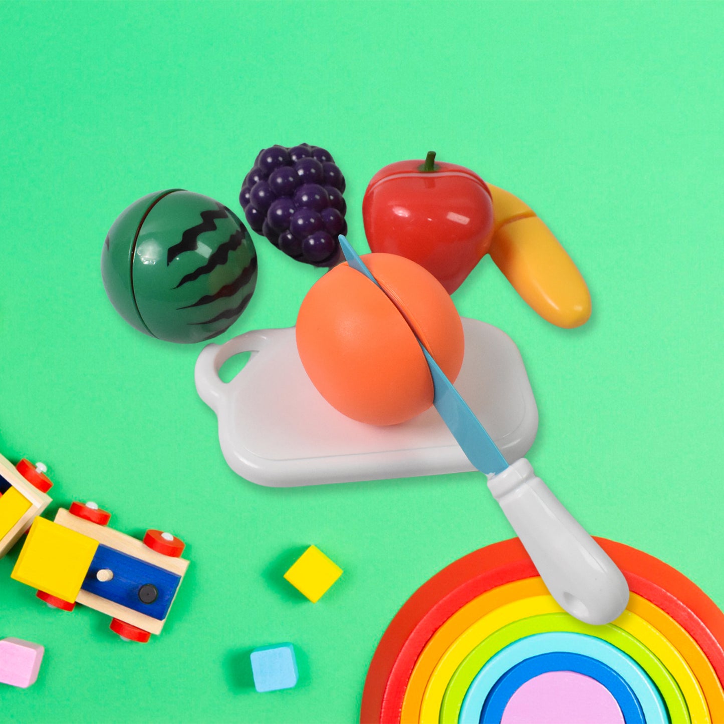 Set of 7 realistic sliceable fruit toys by Wukusy, featuring colorful, detailed plastic fruits for kids to cut and play.