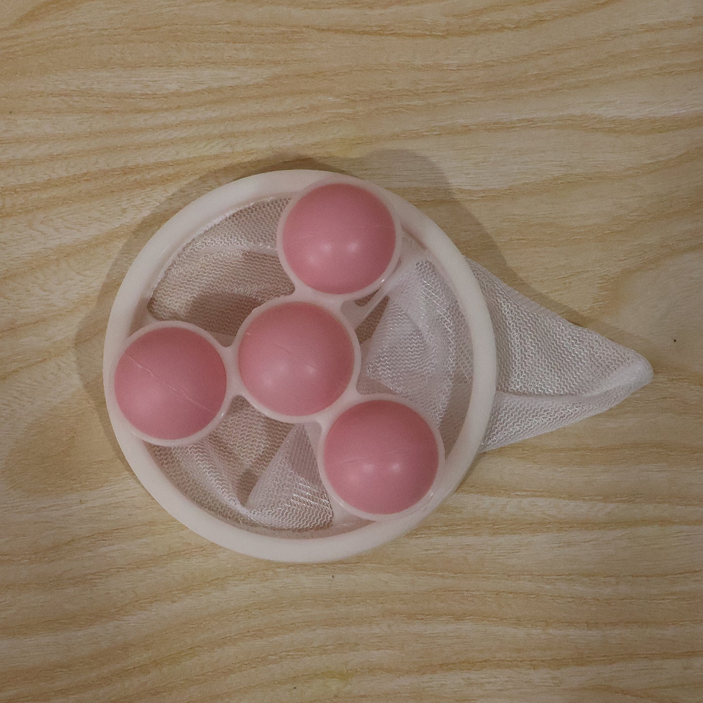 Wukusy washing machine floating hair lint catcher with reusable mesh filter balls for clean laundry and hair removal.