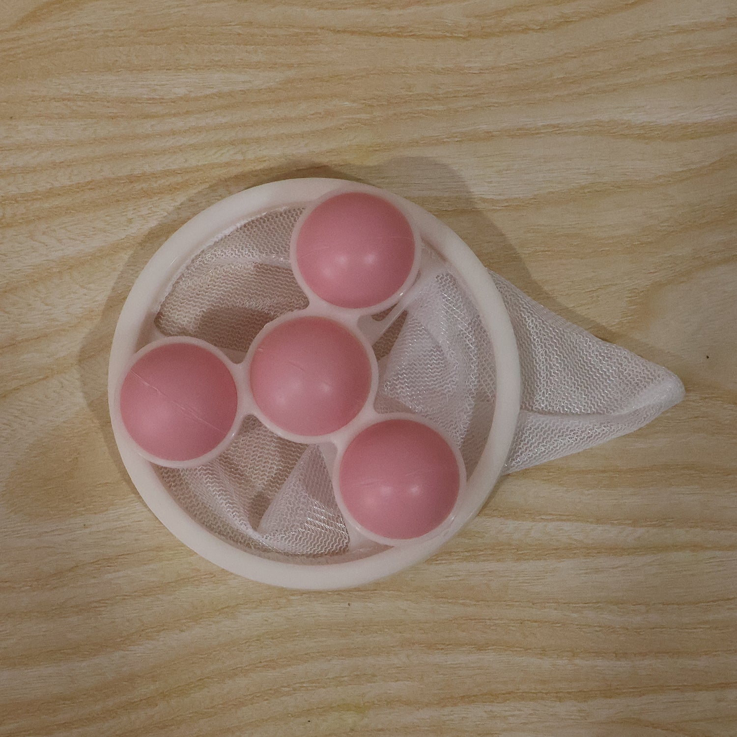 Wukusy washing machine floating hair lint catcher with reusable mesh filter balls for clean laundry and hair removal.