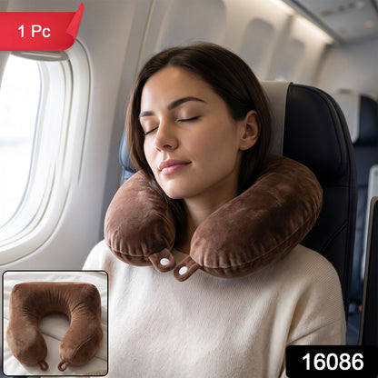 Brown plush U-shaped travel neck pillow by Wukusy, designed for comfortable head and neck support during travel.