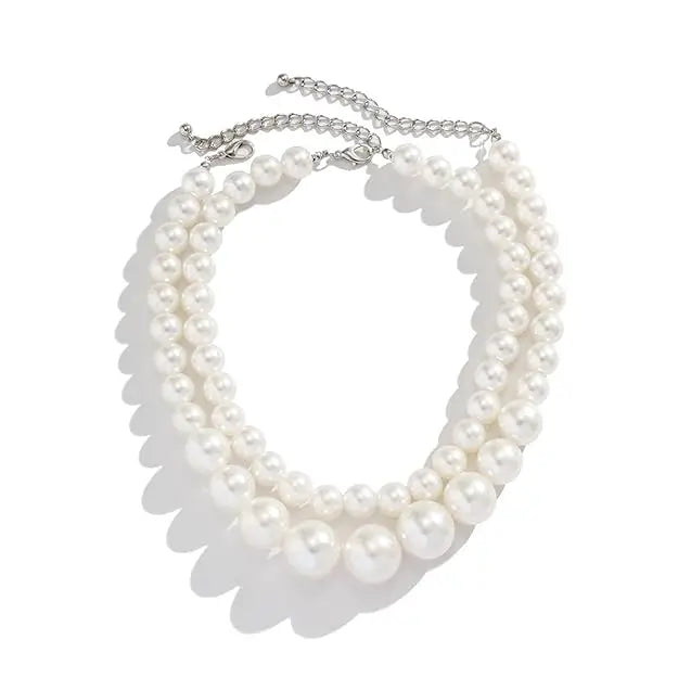 Two-layer artificial pearl mala with matching earrings, elegant imitation jewelry set for traditional and festive occasions.