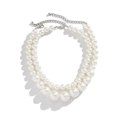 Two-layer artificial pearl mala with matching earrings, elegant imitation jewelry set for traditional and festive occasions.