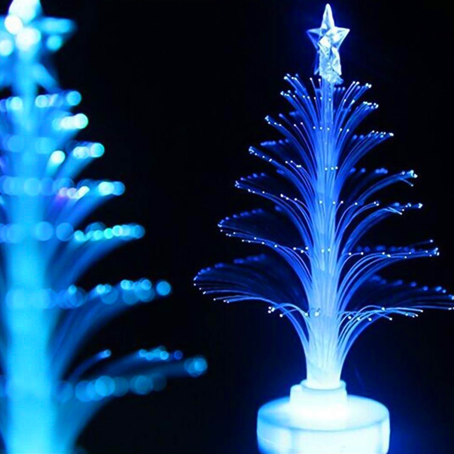 Colorful tree-shaped LED candlelight decoration by Wukusy, ideal for home decor, with vibrant multicolor lighting in a cozy setting.