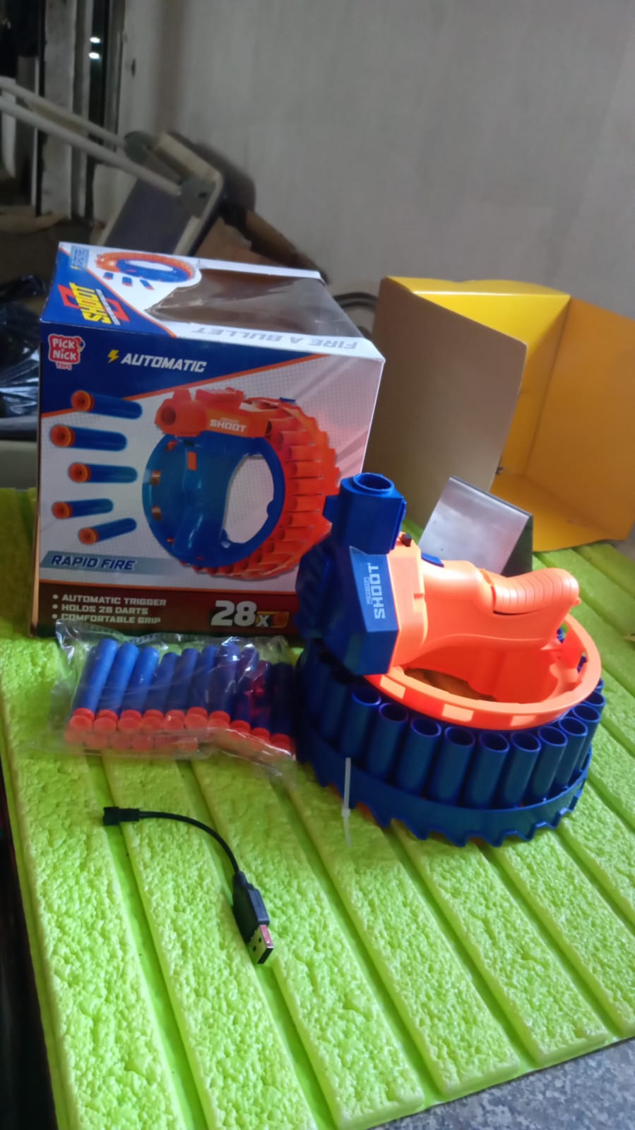 Wukusy electric toy gun for children with 28 soft bullets, featuring a handheld design and safety features for kids' play.