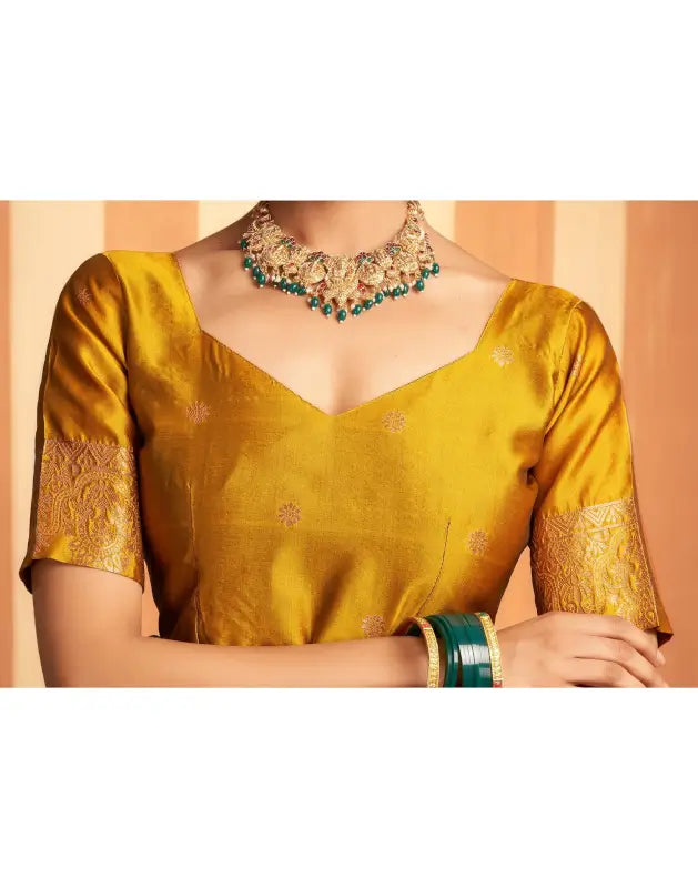 Elegant green silk saree from Ekom's Royal Green Golden Elegance Collection featuring intricate gold detailing for women.