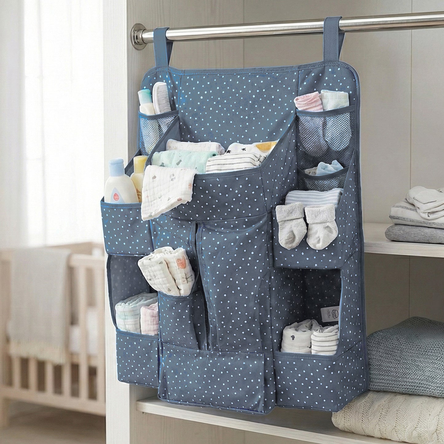 Wukusy multi-pocket hanging baby care organizer with multiple compartments for diapers, bottles, and baby essentials.