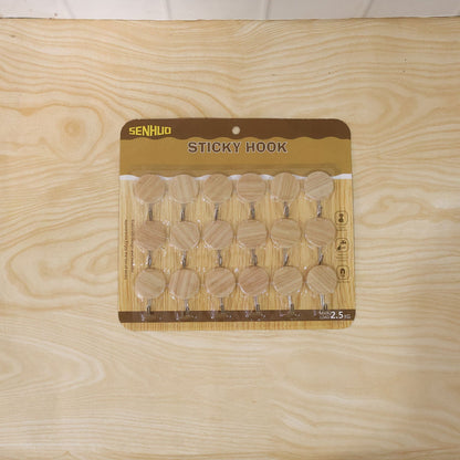 Wukusy self-adhesive wooden look wall hooks, strong sticky hangers without drilling, shown attached to a wall in a set of 18 pieces.