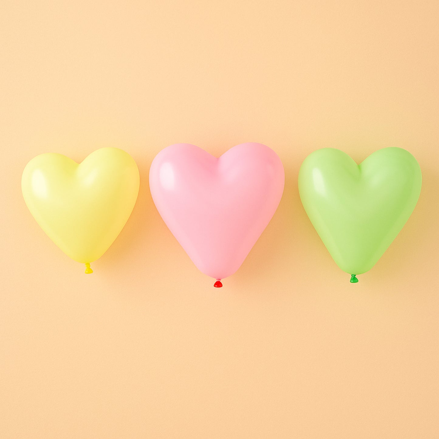 Heart-shaped balloon toy by Wukusy, featuring a glossy pink and red heart design, suitable for celebrations and decorations.