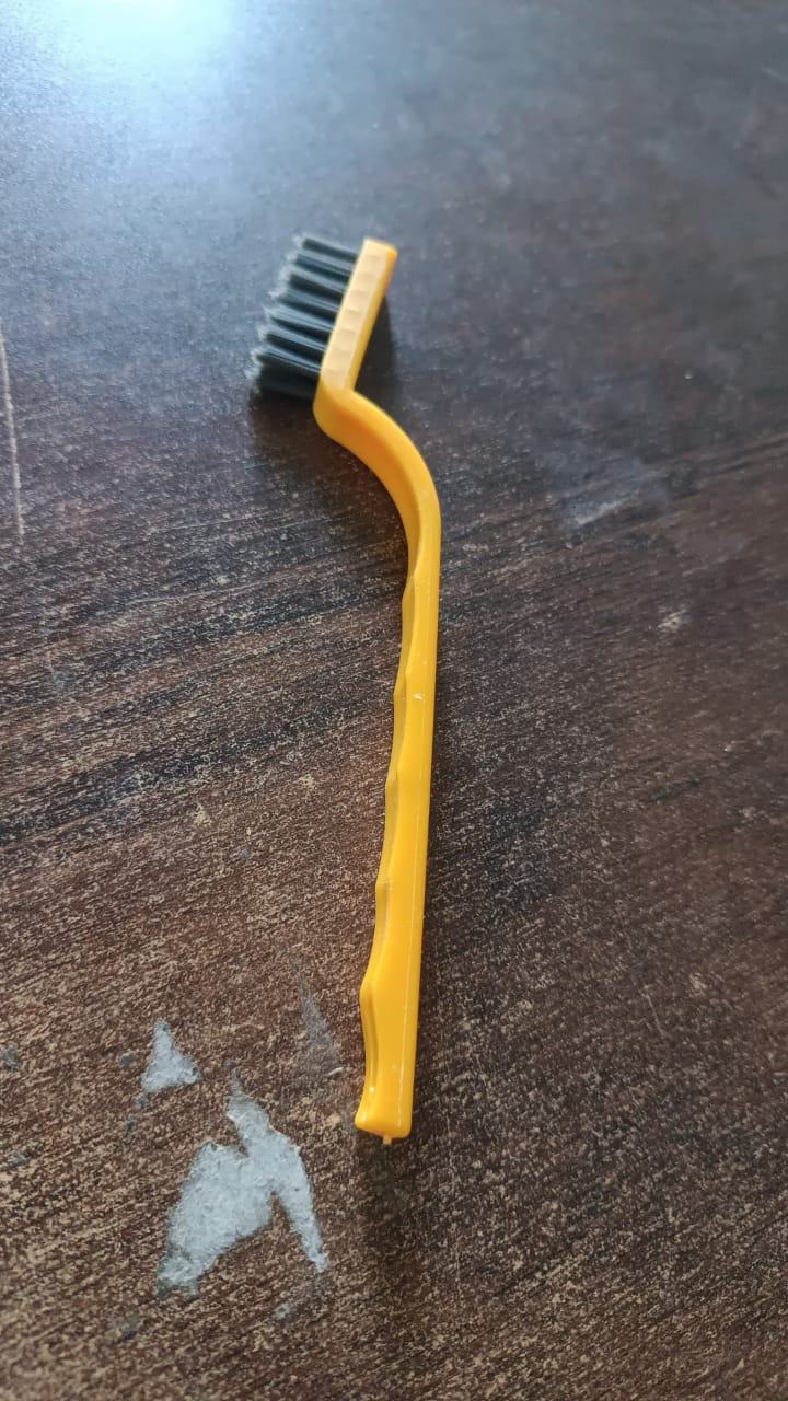 Wukusy mini nylon wire brush for home cleaning, showing a compact hand-held brush with nylon bristles for scrubbing surfaces.