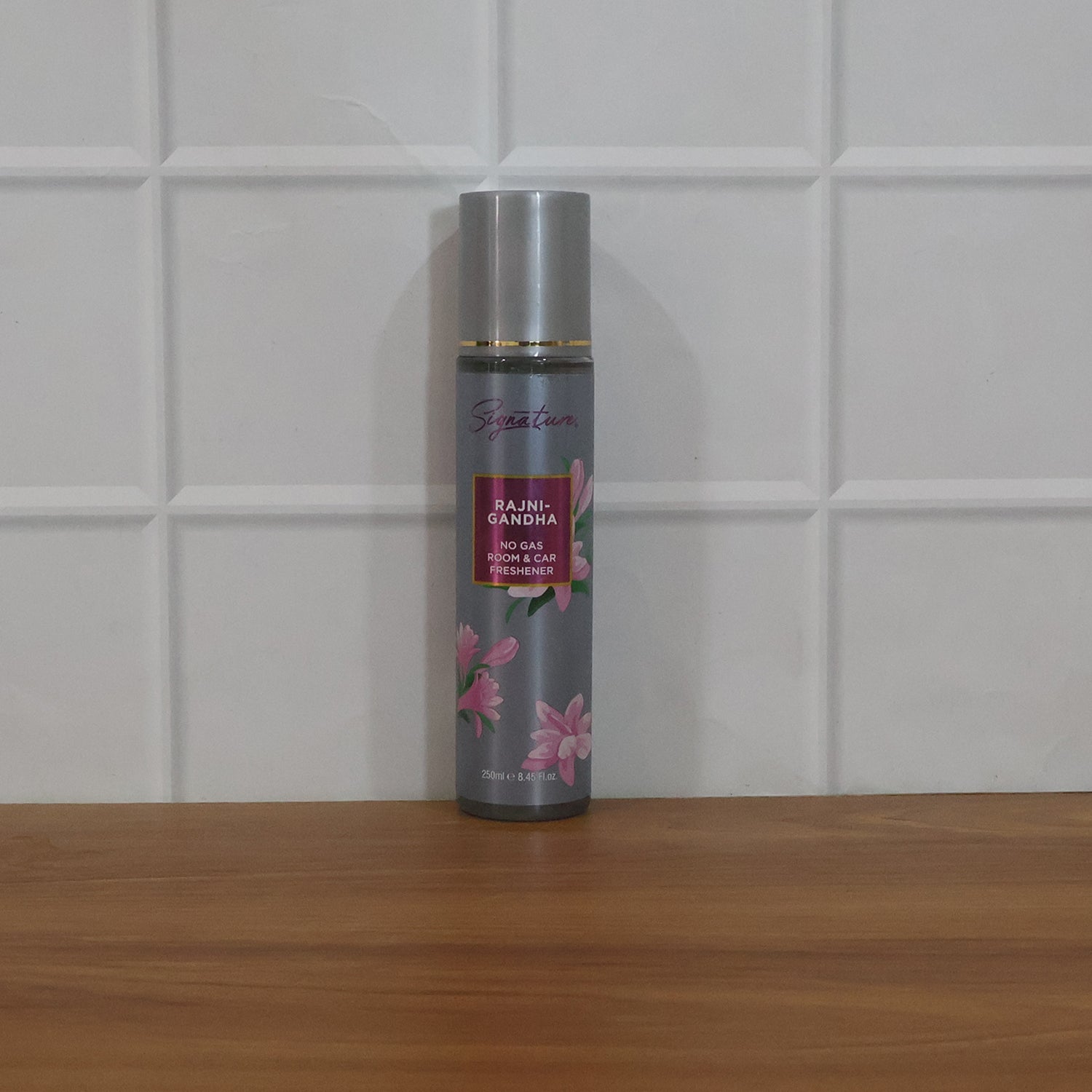 Wukusy Signature Rajnigandha room and car freshener spray bottle, 250ml, with floral fragrance and sleek design.