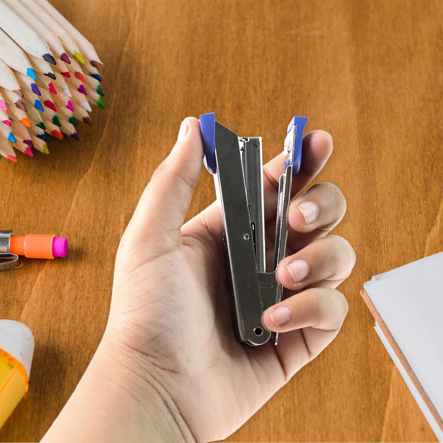 Wukusy Kangaro No.10 compact metal office stapler with silver finish and ergonomic design on a white background.