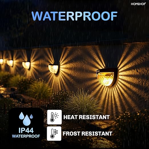 Set of four Drpshippr LED solar-powered fence lights illuminating outdoor fencing with energy-efficient lighting.