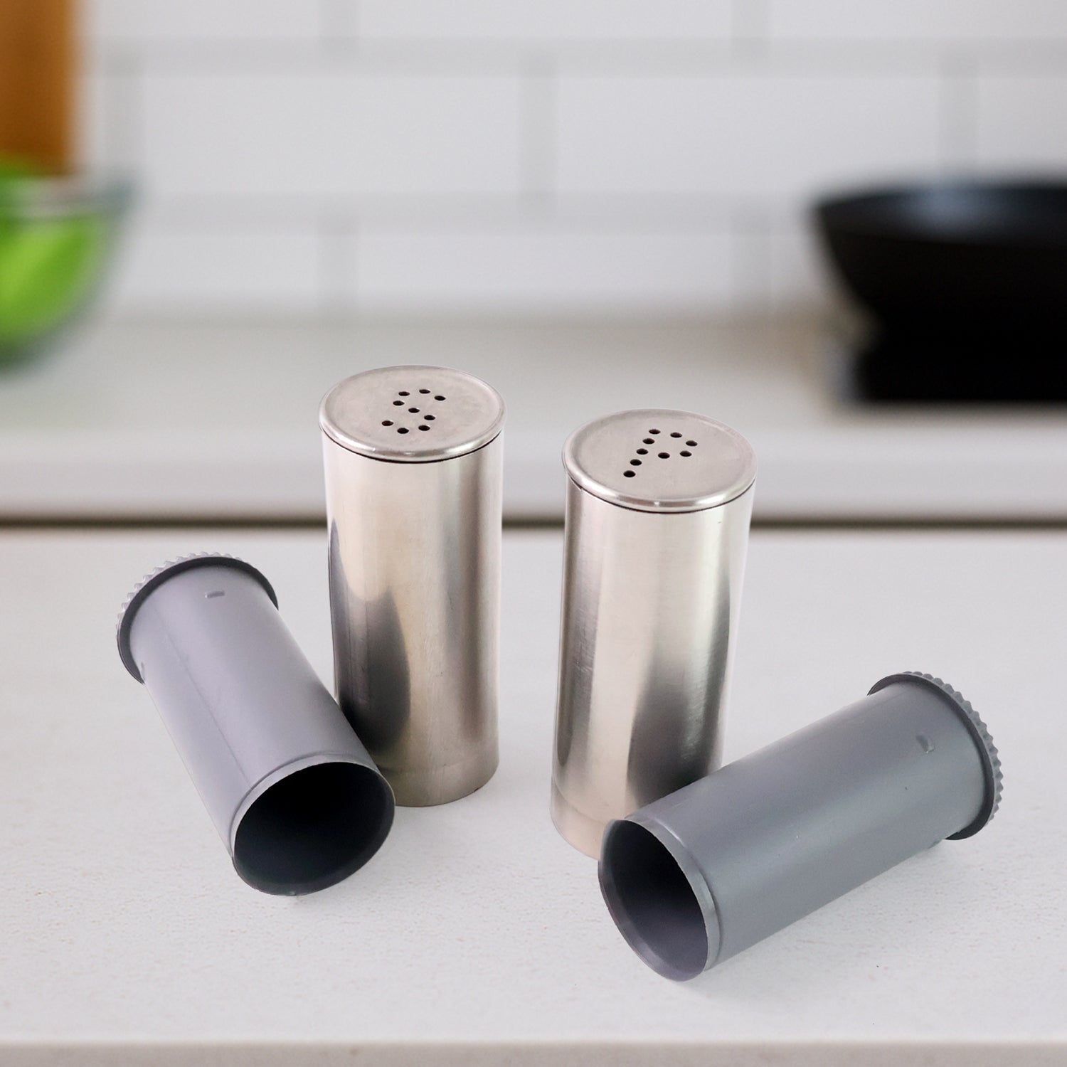 Wukusy stainless steel salt and pepper shaker set with sleek, modern design and clear tops for easy refilling.