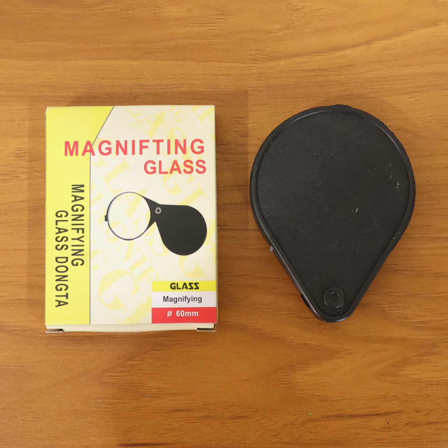 Wukusy portable handheld magnifying glass with ergonomic handle, close-up view showing clear lens for detailed inspection.