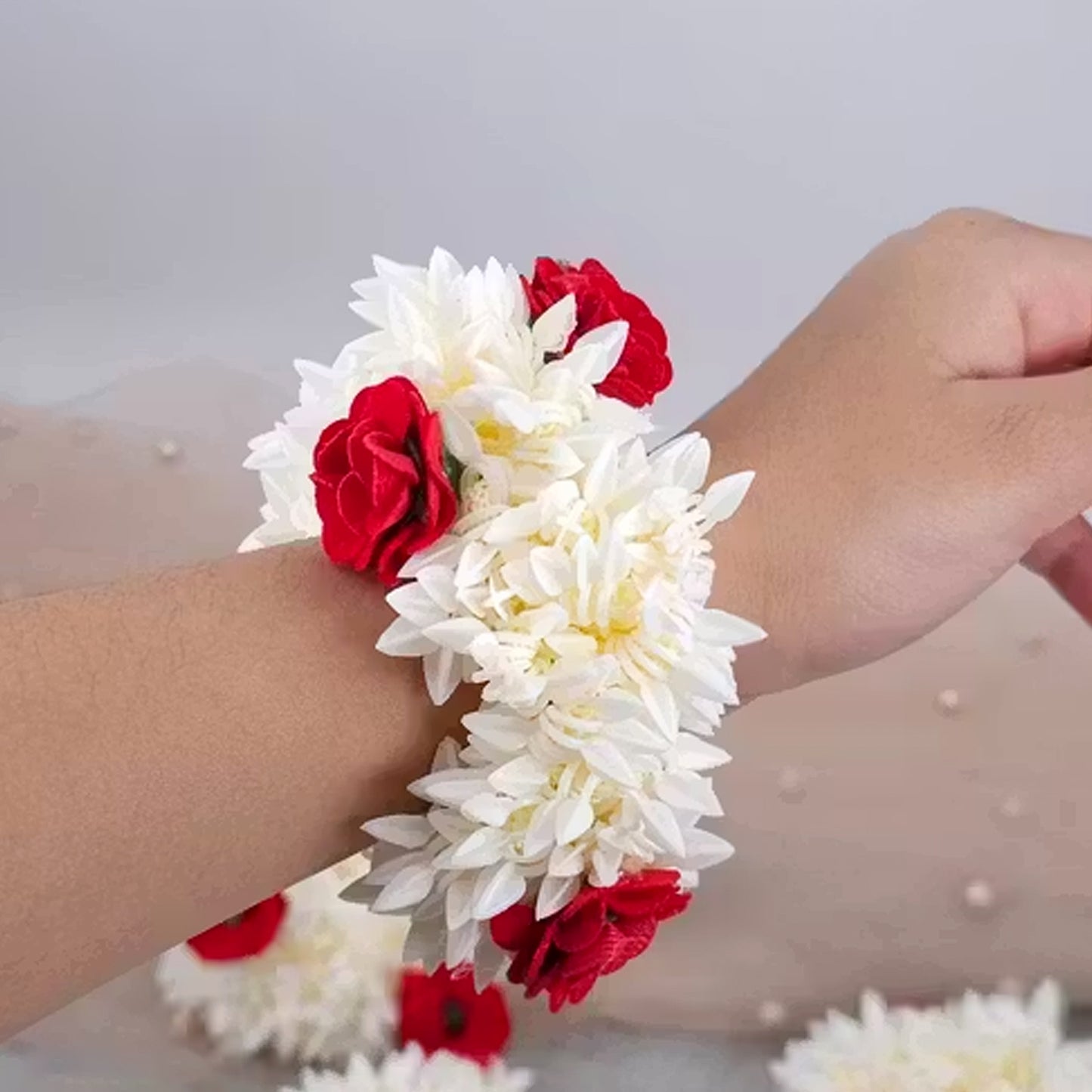 Artificial flower Gajra from Wukusy with traditional design, showcasing delicate white and green floral strands for festive wear.