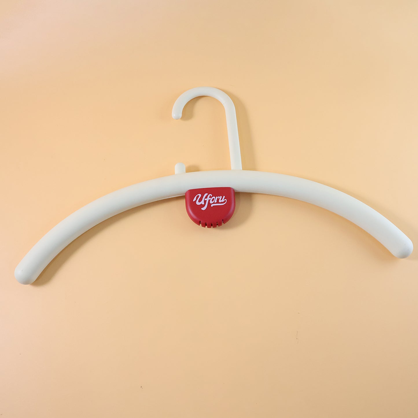 Wukusy plastic clothes hanger with anti-slip design and fragrance holder, suitable for hanging clothes securely.