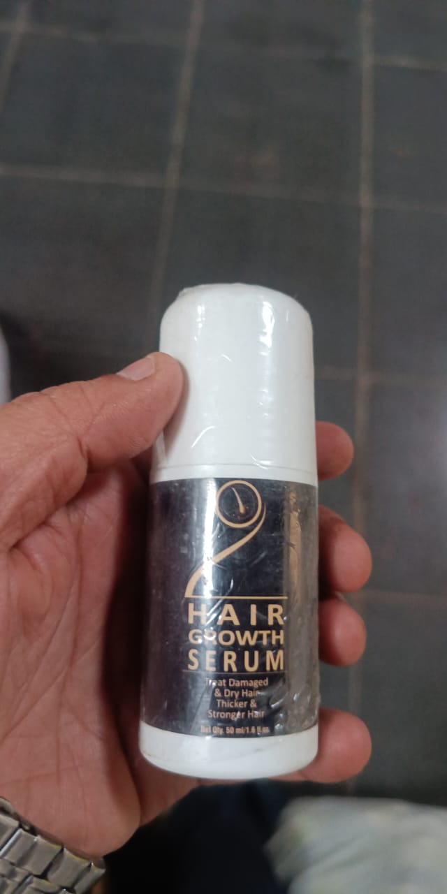 5912 Hair Growth Serum in a bottle, designed to promote hair growth and improve scalp health, part of stretch marks and scar care products.