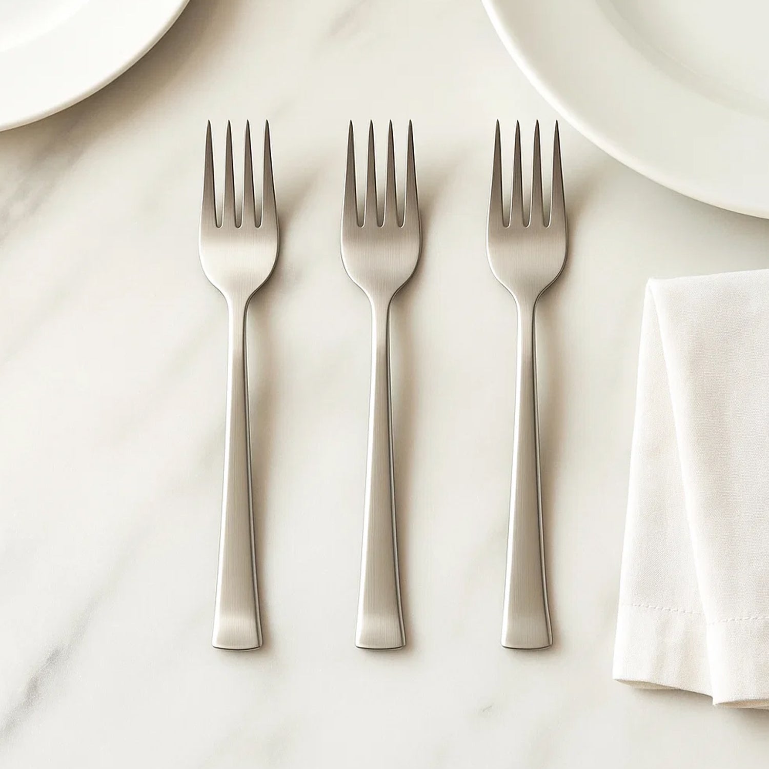 Set of three Wukusy premium stainless steel dinner forks for home and kitchen use, featuring sleek polished finish and ergonomic handles.