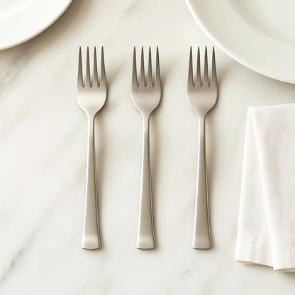 Set of three Wukusy premium stainless steel dinner forks for home and kitchen use, featuring sleek polished finish and ergonomic handles.