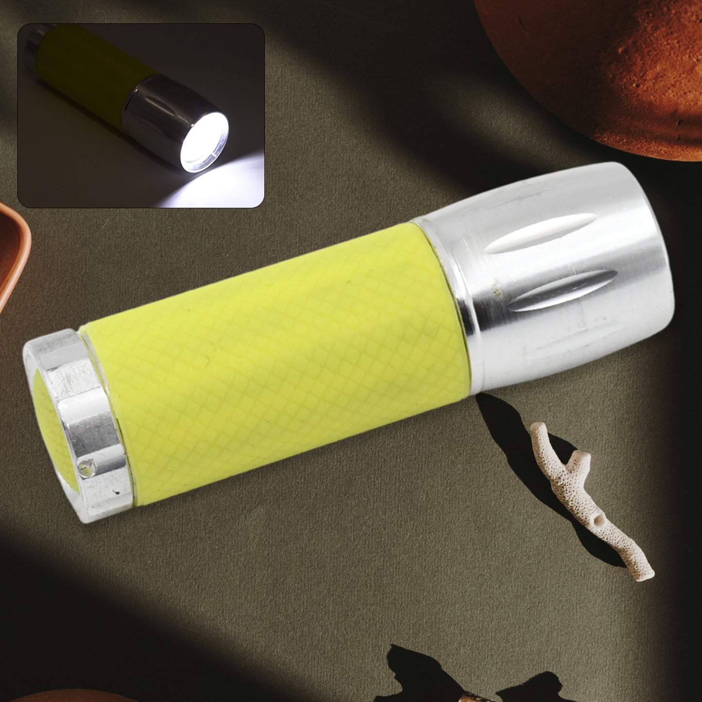 Wukusy portable mini torch flashlight with 9 LED lights, compact pocket design, powered by 3 batteries (not included).