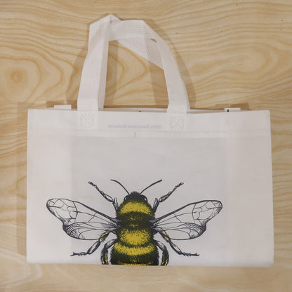 Wukusy multipurpose carry hand bag with a vibrant bee print, featuring a spacious design and sturdy handles for versatile use.
