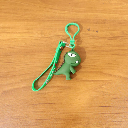 Cute dinosaur cartoon silicone keychain by Wukusy featuring a colorful dinosaur design on a keyring.