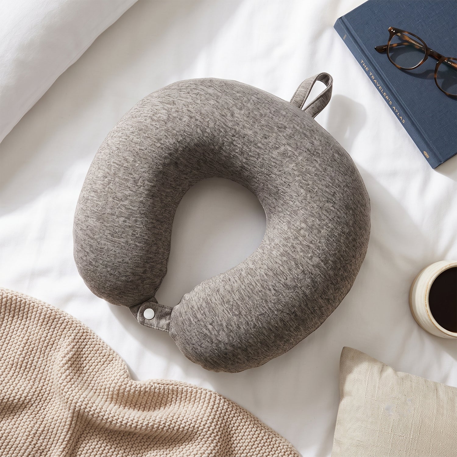 Grey melange U-shaped travel neck pillow by Wukusy, soft head and neck support for comfortable travel.