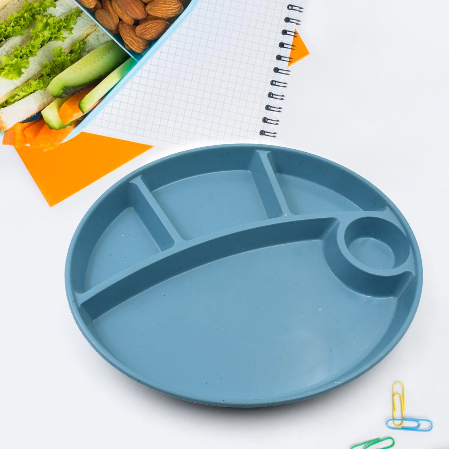 Wukusy 5577 plastic biodegradable food plate with five compartments and spoon, ideal for snacks, desserts, and outdoor camping.