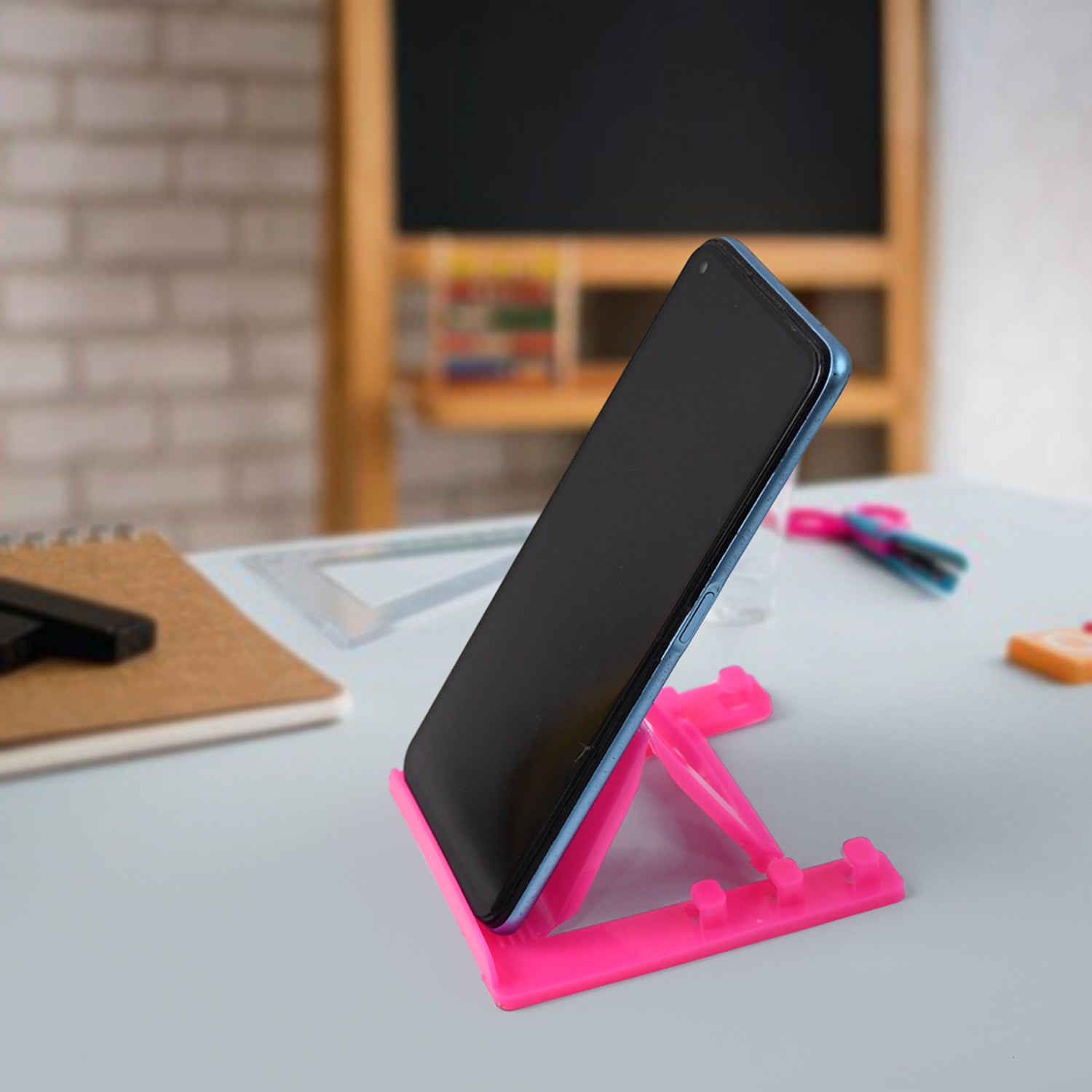 Wukusy adjustable foldable plastic mobile phone stand holder showing a compact, lightweight design in a neutral color.