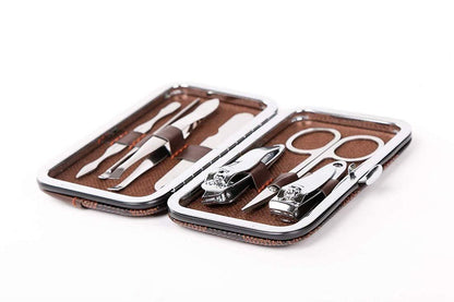 Wukusy 7-in-1 pedicure and manicure tools kit for women with stainless steel nail care tools and ergonomic handles.