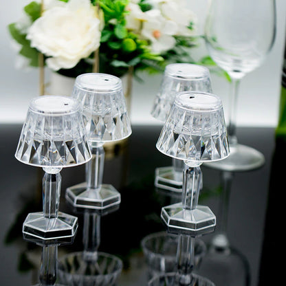 Wukusy 6610 2-in-1 transparent mini crystal table lamp with reflection light, showcasing its sleek design and glowing crystal details.