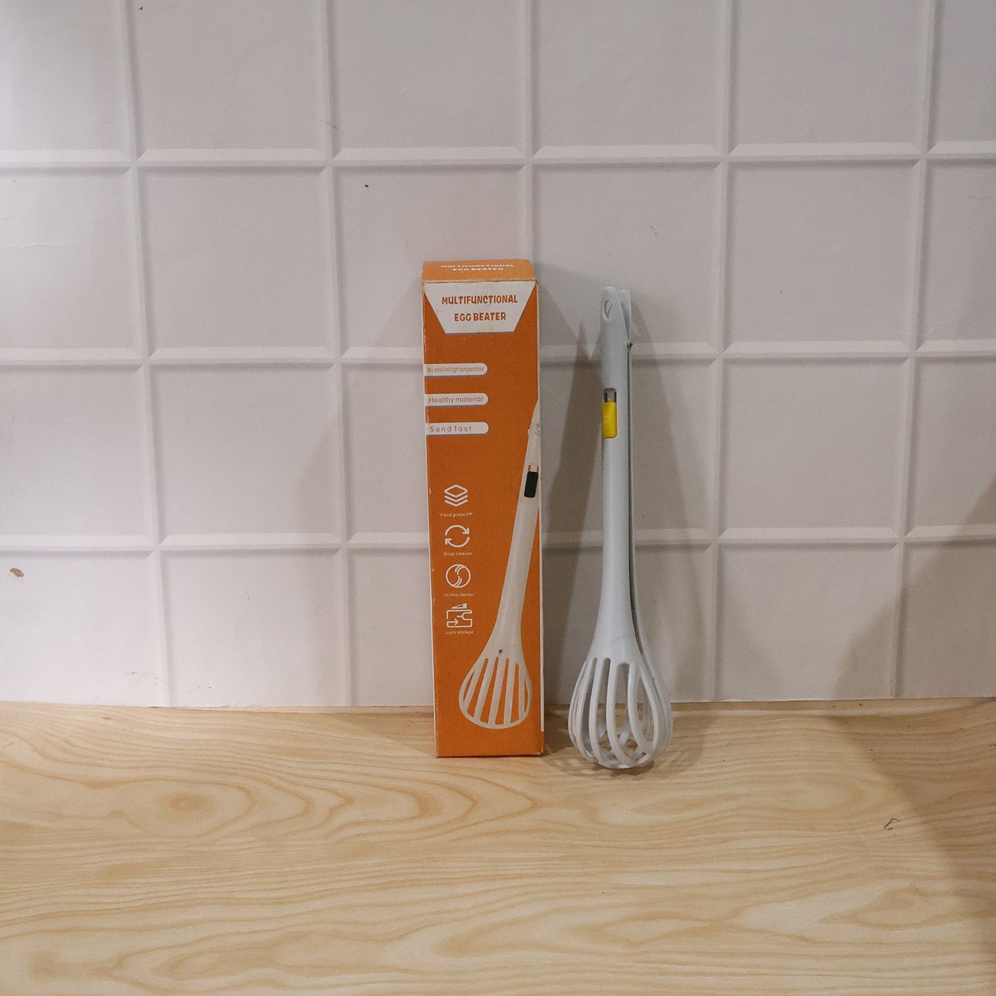 Wukusy manual egg beater, versatile kitchen tool for mixing eggs and batters, with stainless steel blades and ergonomic handle