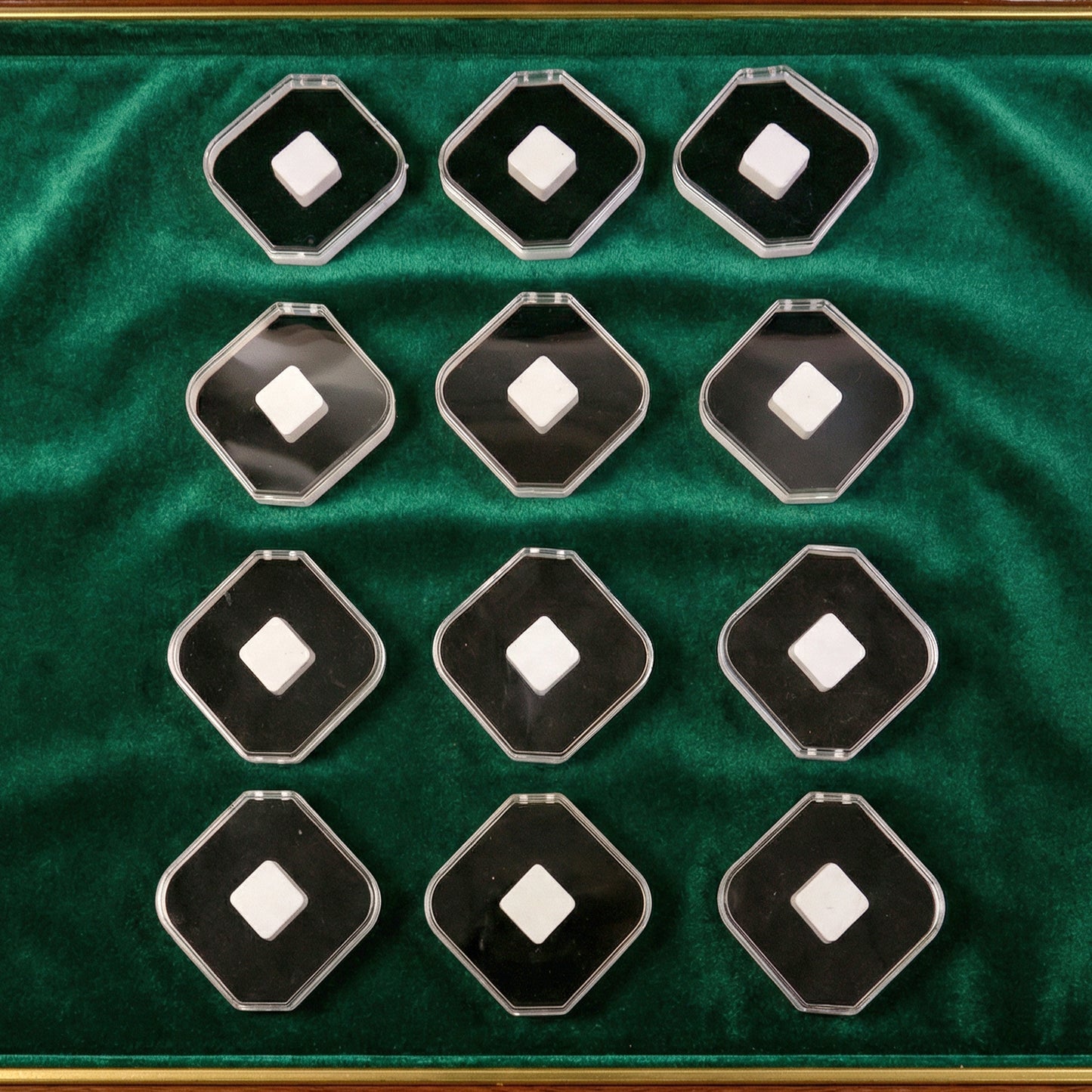 Wukusy jewelry display storage box with 12 compartments for rings, earrings, and small jewelry items, compact and organized.