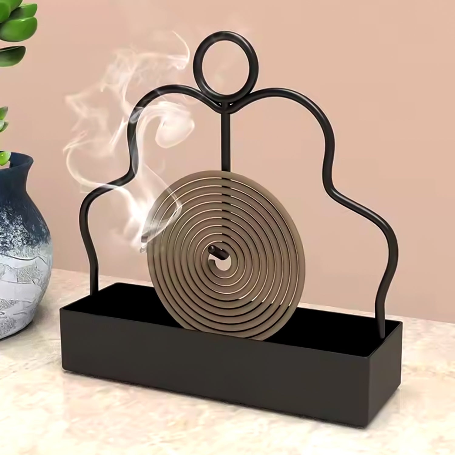 Wukusy mosquito coil holder stand, black metal design, for outdoor use, with a circular base and coil holder on top.