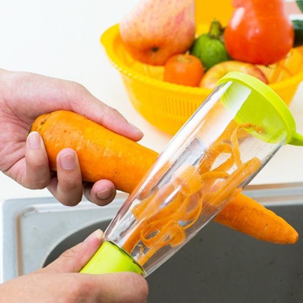 Wukusy 2404 smart multifunctional vegetable and fruit peeler, kitchen tool with ergonomic handle and stainless steel blade.