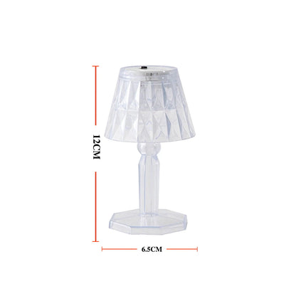 Wukusy 6610 2-in-1 transparent mini crystal table lamp with reflection light, showcasing its sleek design and illuminated crystal features.